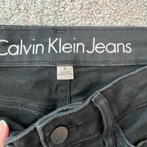 Slightly distressed black Calvin Klein ankle jeans. So trendy!